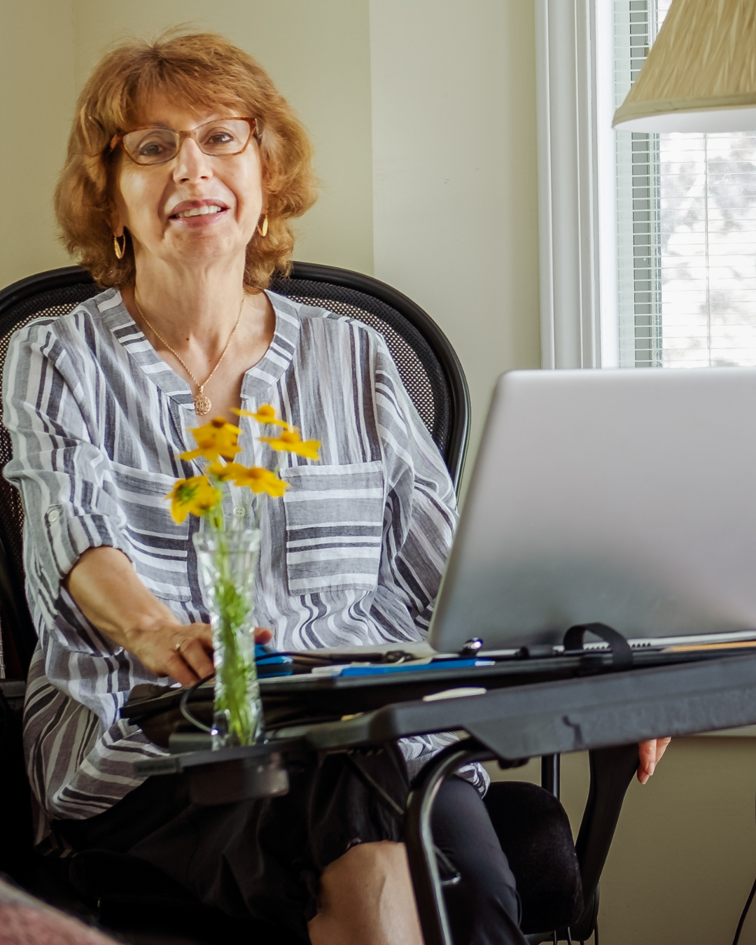 Older woman speaking during an online session