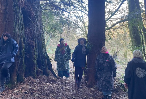 Women gathered among the trees during The Change programme