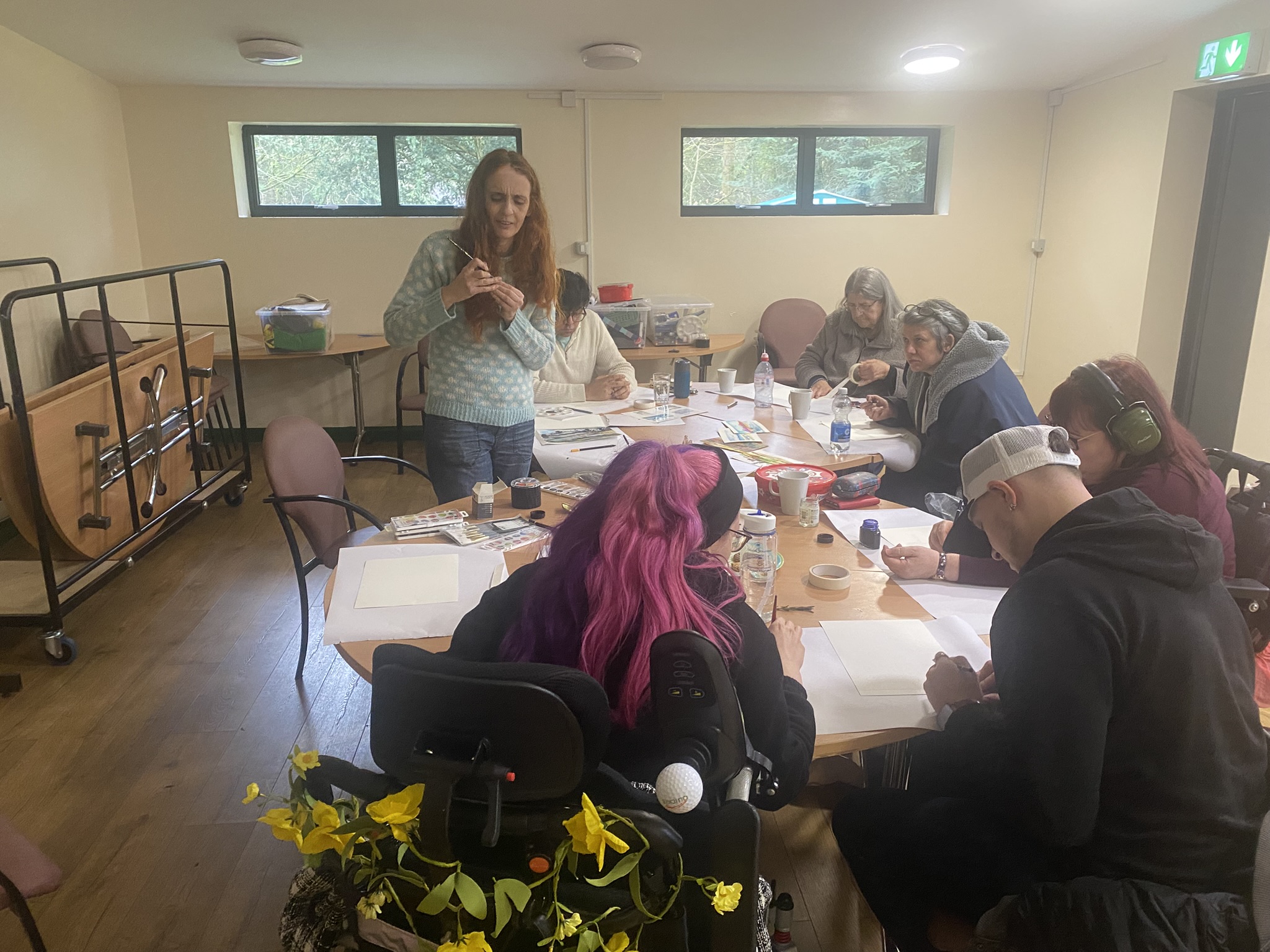 Head Outdoors Mobility participants taking part in a creative group session