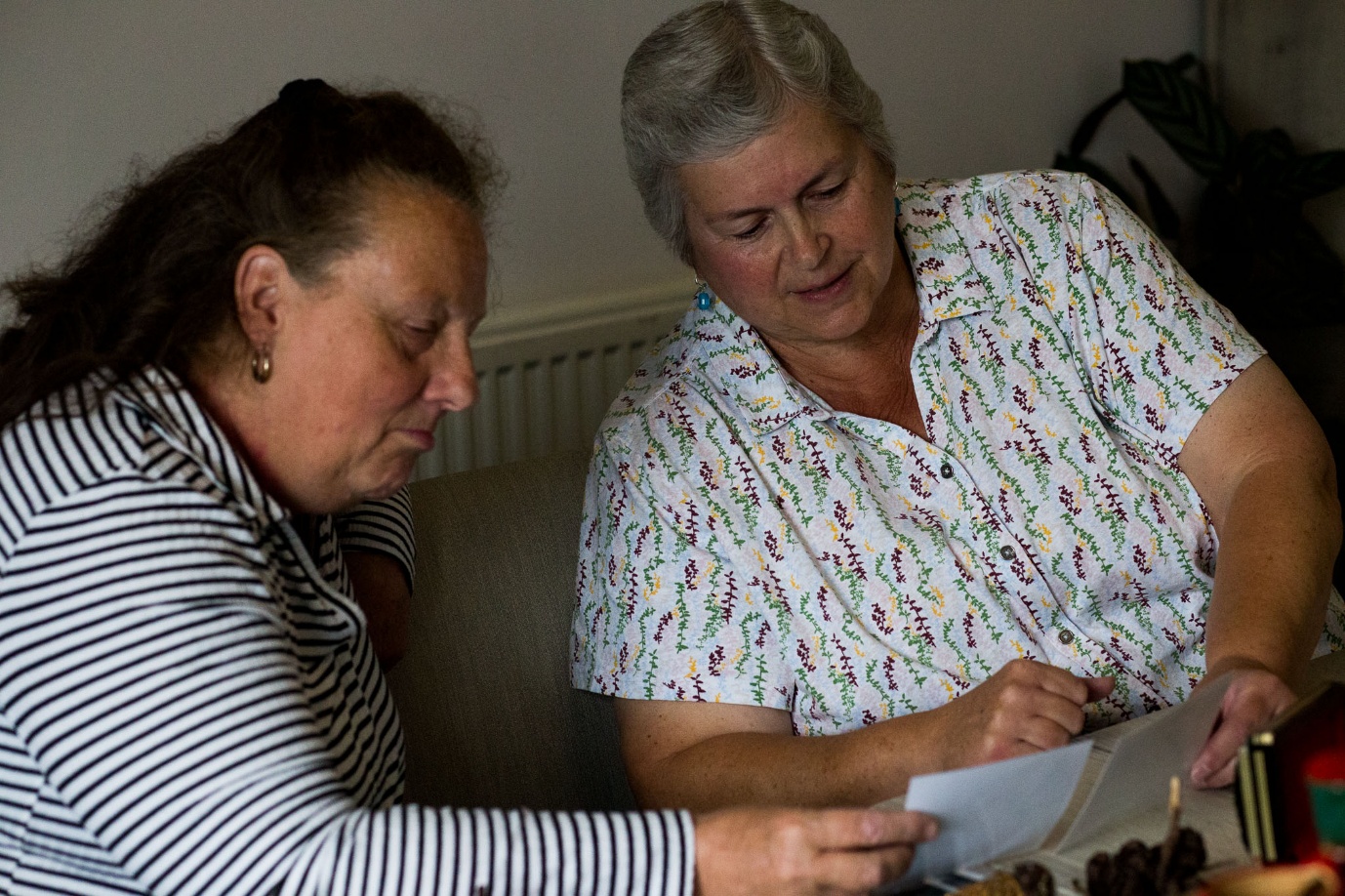 Residents sharing and discussing photographs together